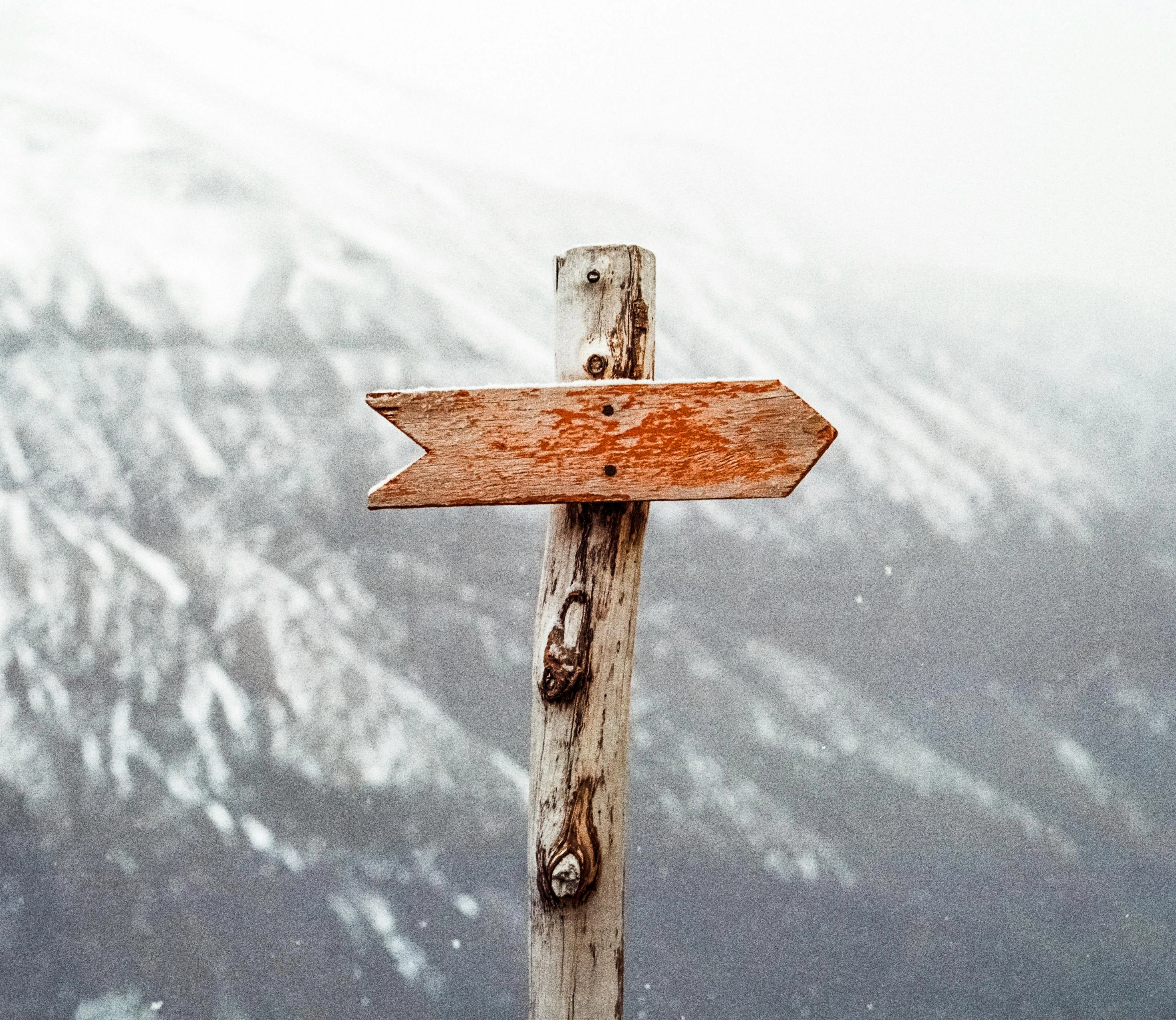 Wayfinding sign on a hiking path in the mountains representing direction and guidance