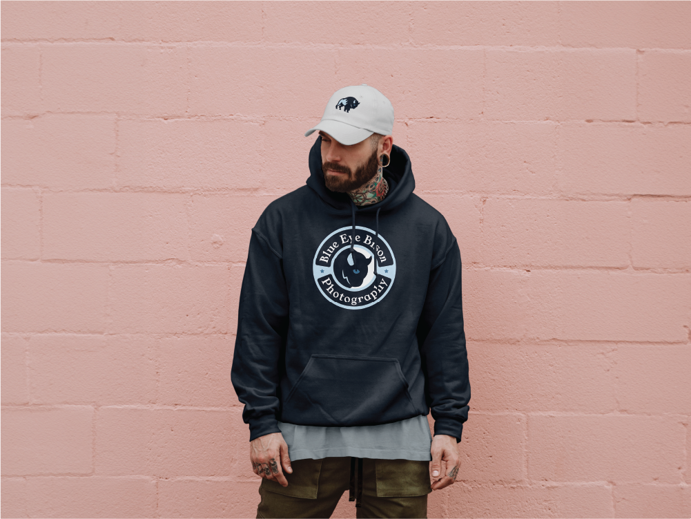 Circular Blue Eye Bison badge logo on a dark blue hoodie.